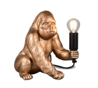 Gold gorilla lamp holding a light bulb on a white background