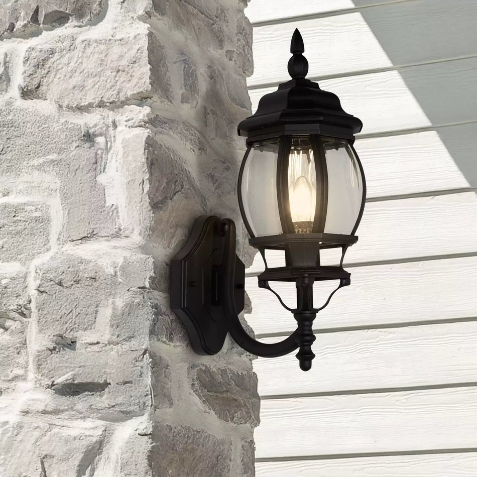 Outdoor wall light fixture on a stone wall