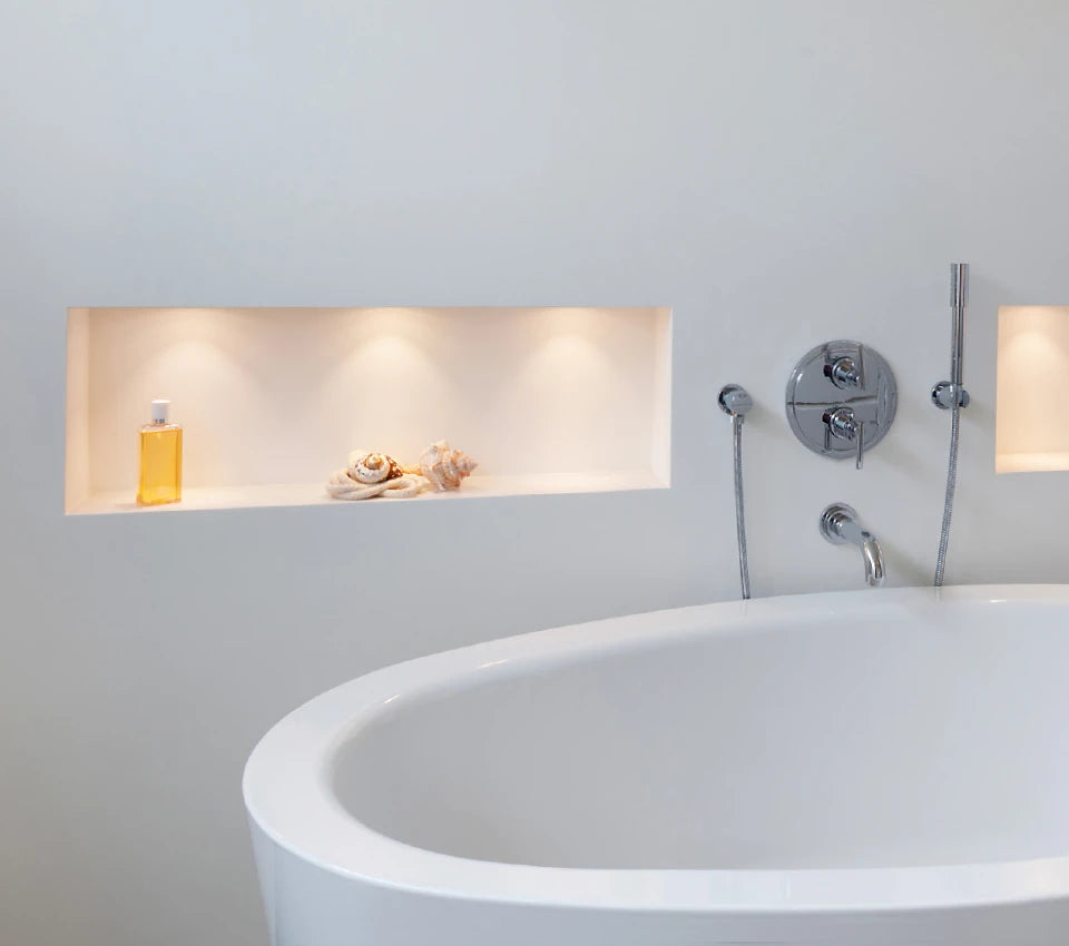 Modern bathroom with a freestanding bathtub and wall-mounted faucet.