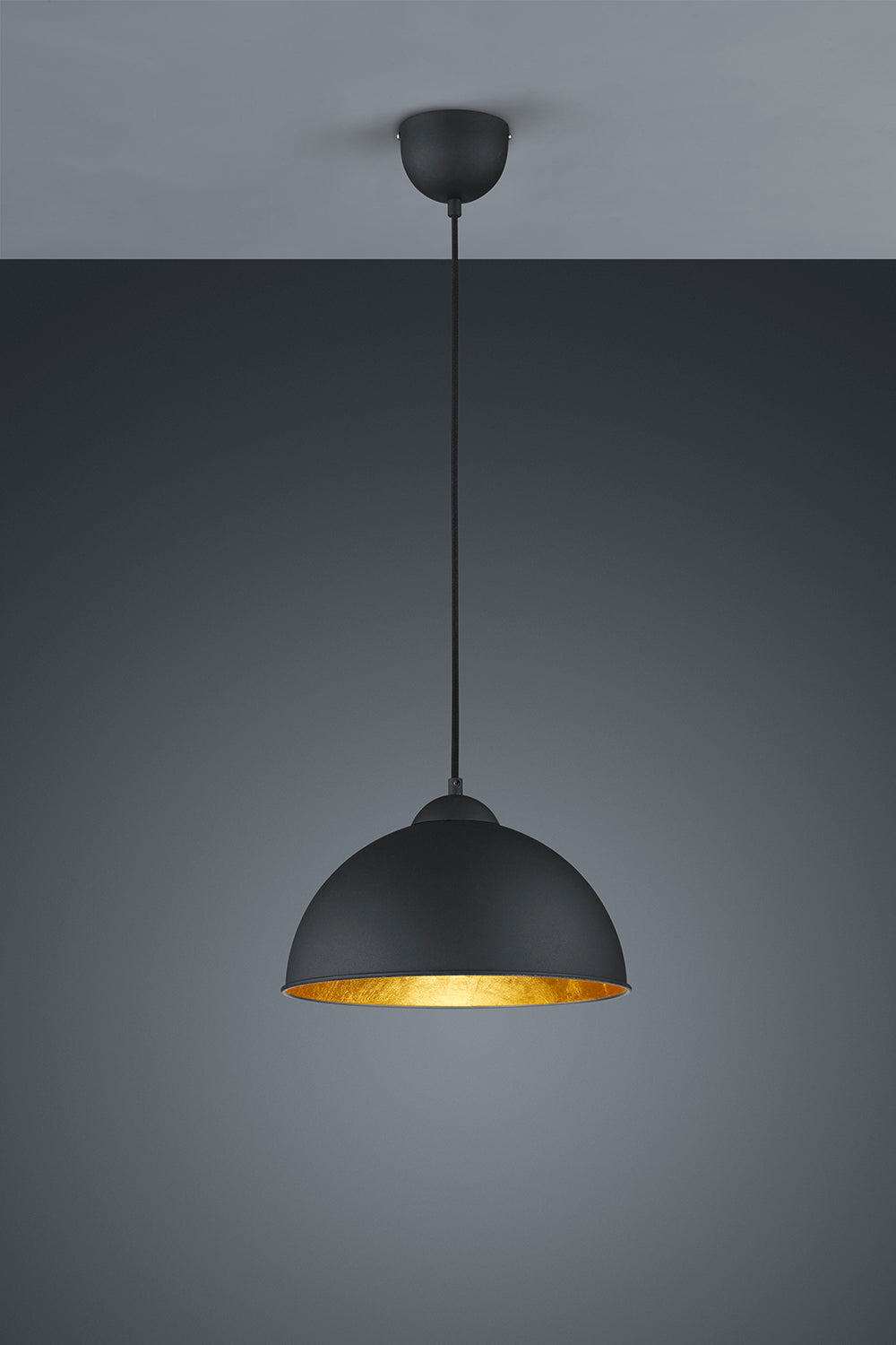 Black pendant light with gold interior on a gray background