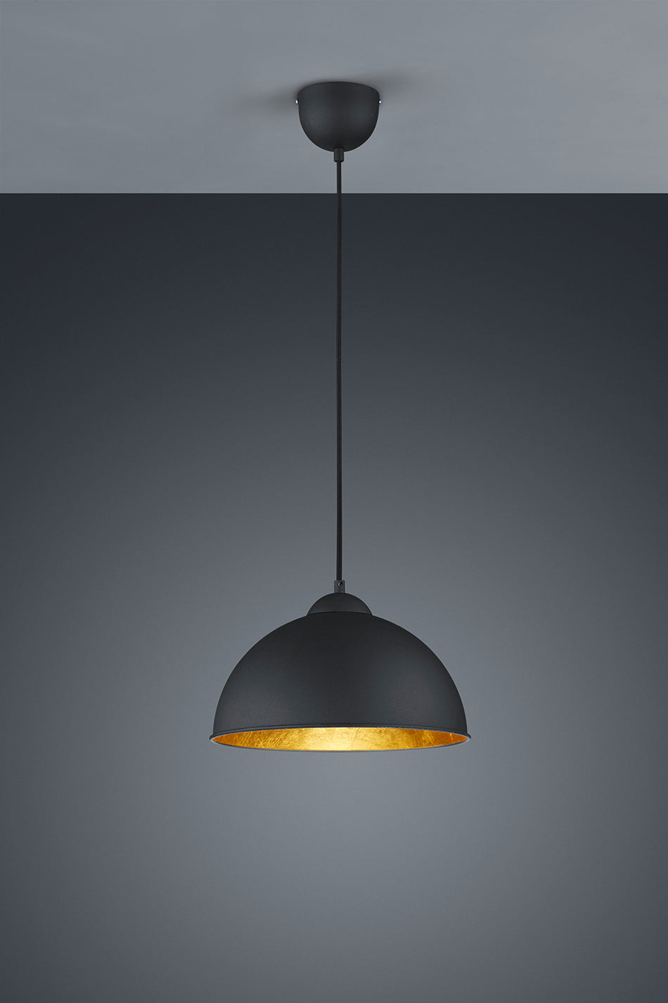 Black pendant light with gold interior on a gray background