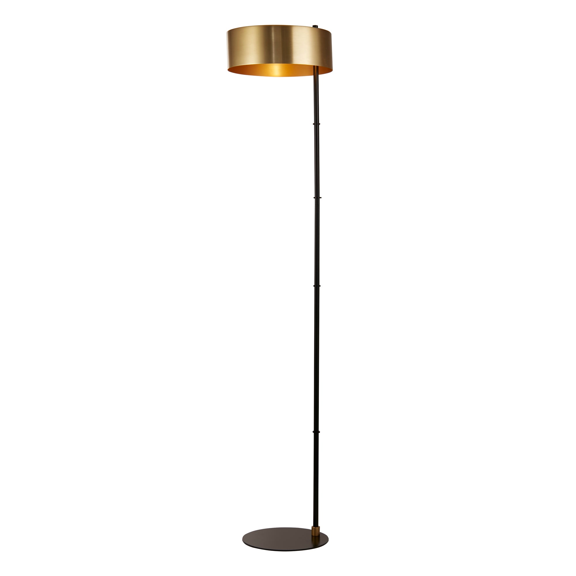 A contemporary floor lamp with a black and gold metal base and a drum-shaped satin shade.