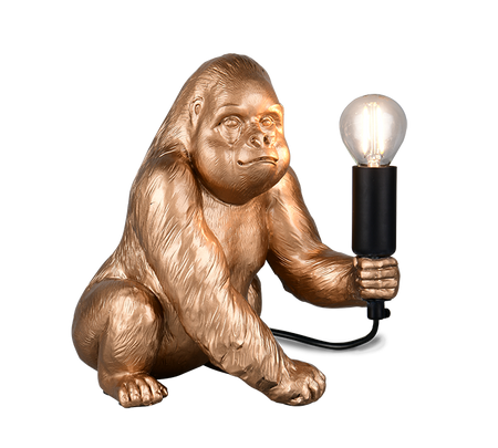 Gold gorilla lamp holding a light bulb on a white background