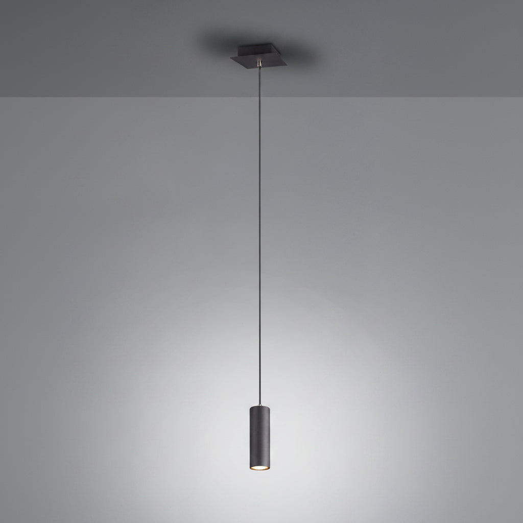 Modern pendant light fixture hanging against a plain background