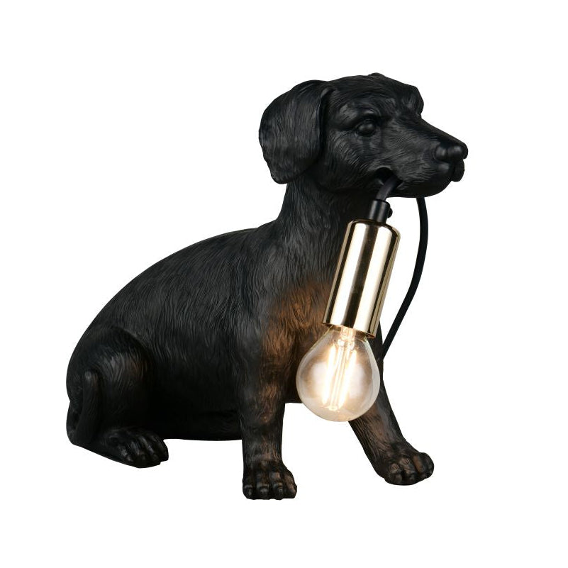 Black dog-shaped lamp with a lit bulb on a white background