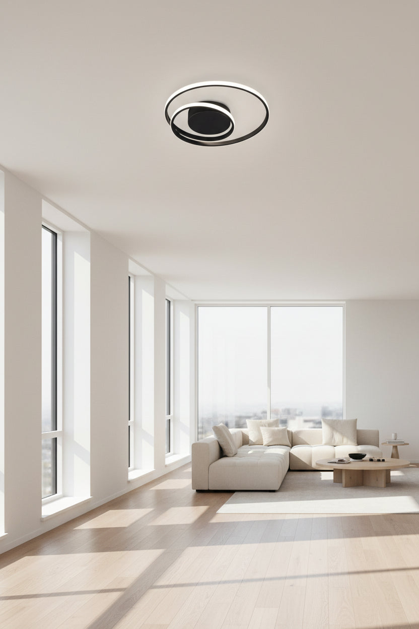 Modern ceiling light fixture in a kitchen with white walls and a window.