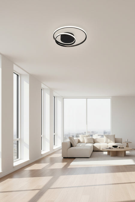 Modern ceiling light fixture in a kitchen with white walls and a window.